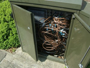 A Virgin Media cabinet open to the elements